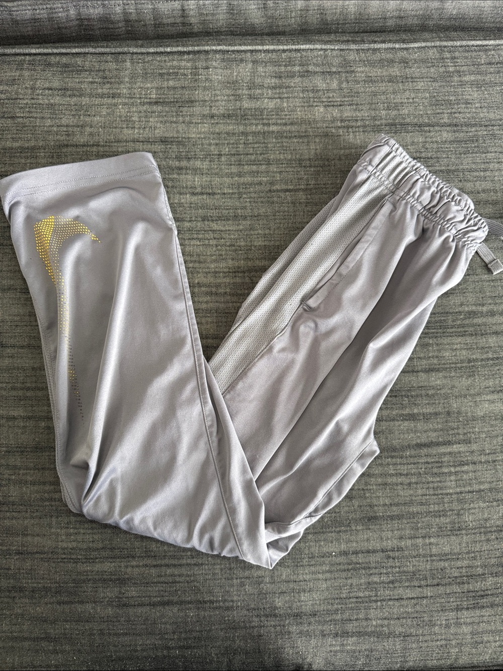 Nike Kids Light Gray Joggers with Gold Swoosh Accent